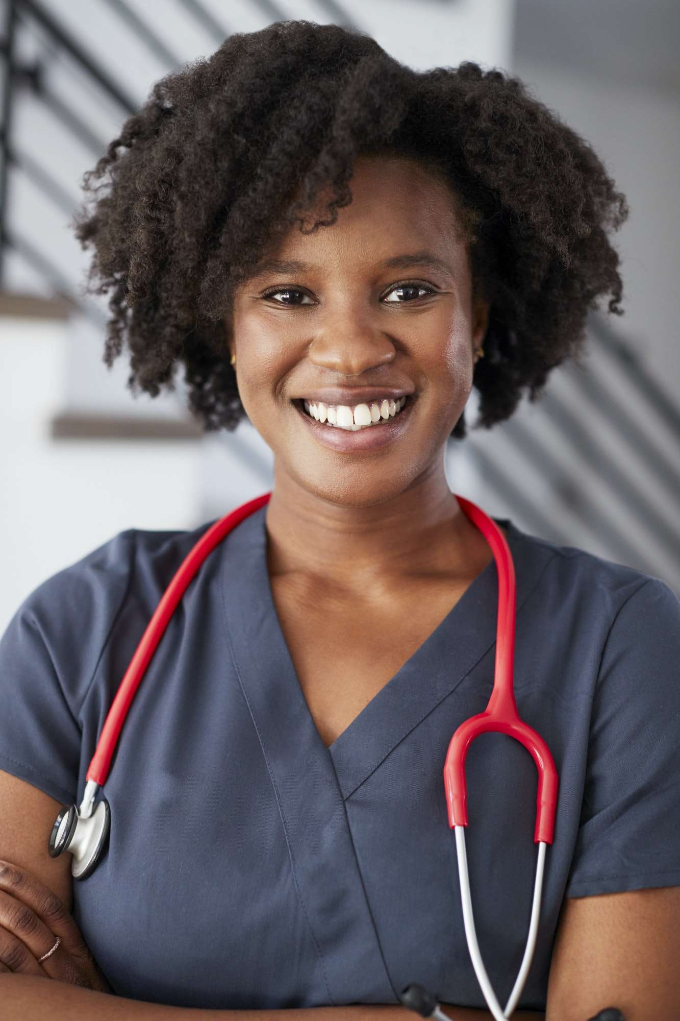 Licensed pediatric home health nurse in scrubs ready to provide in-home skilled nursing in Atlanta